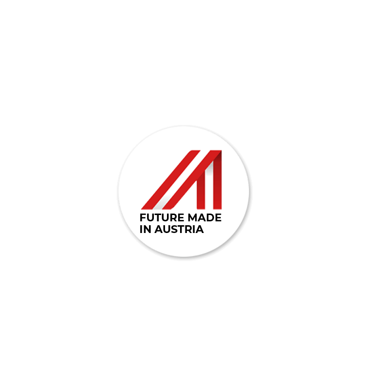 Das Logo zeigt ein stilisiertes "A" in Rot, das durch drei diagonale Linien dargestellt wird. Unter dem "A" steht der Text "FUTURE MADE IN AUSTRIA" in schwarzen Großbuchstaben. Das Logo ist in einem weißen Kreis platziert, der von einem dünnen schwarzen Rahmen umgeben ist.