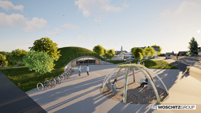 Modernes, umweltfreundliches Gebäude mit begrüntem Dach und Fahrradparkplatz in einer ruhigen Stadtlandschaft.