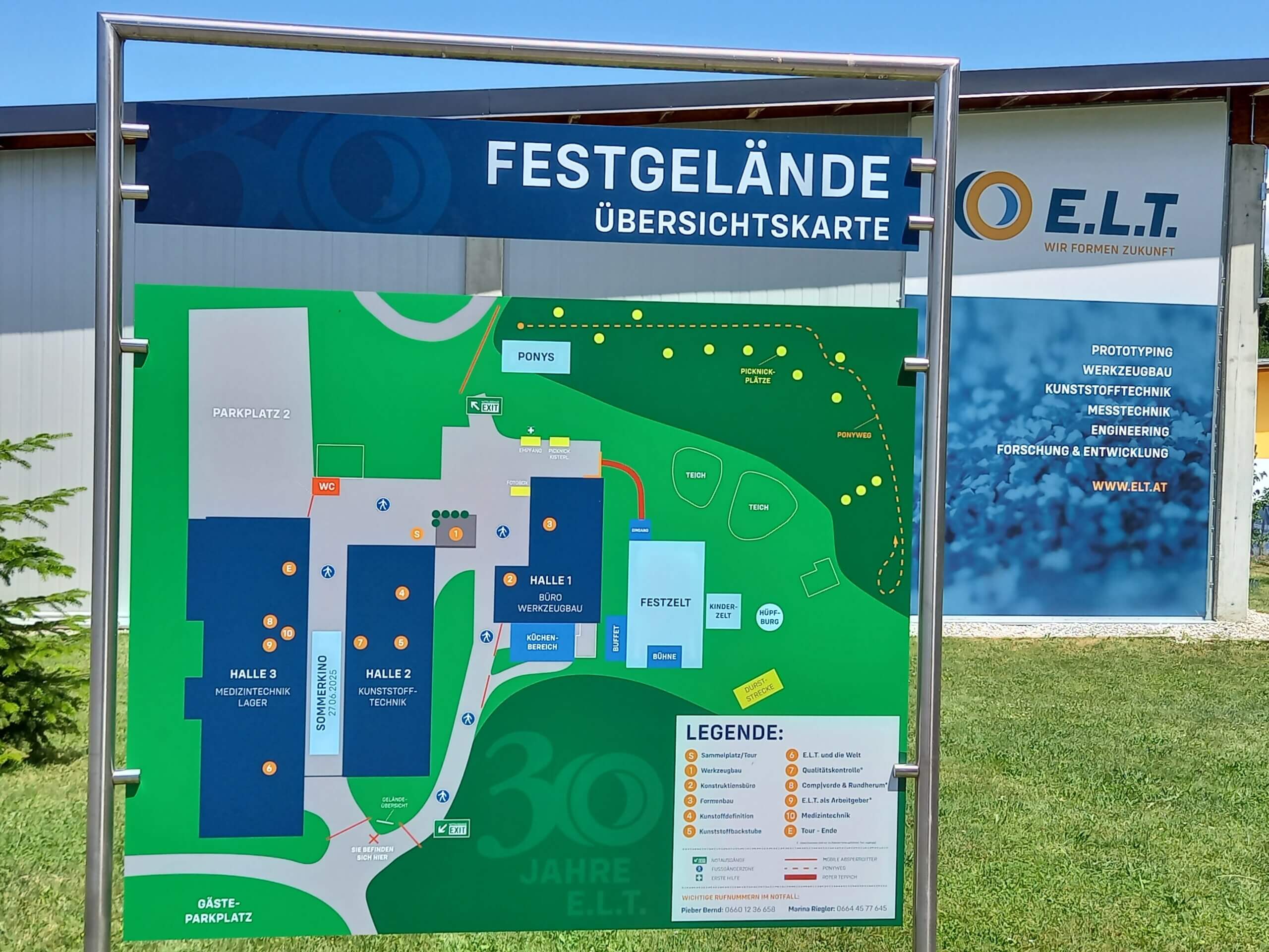Übersichtskarte des Festgeländes der E.L.T., mit Hallen, Parkplätzen und Beschriftungen auf grünem Hintergrund.