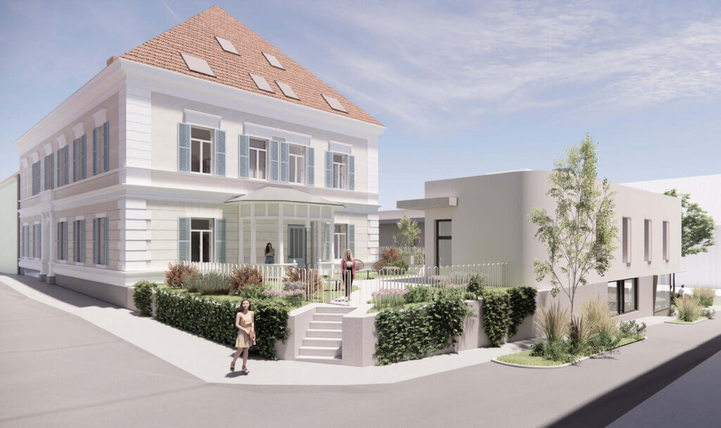 Modernes Gebäude mit Garten, Menschen auf dem Gehweg, sonniger Tag. Passend für regionales Magazin oder Architekturthema.