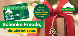 Geschenkbox mit rotem Band und Lagerhaus-Gutscheinkarte, ideal zum Verschenken in der Region. Perfekt für Weihnachten.